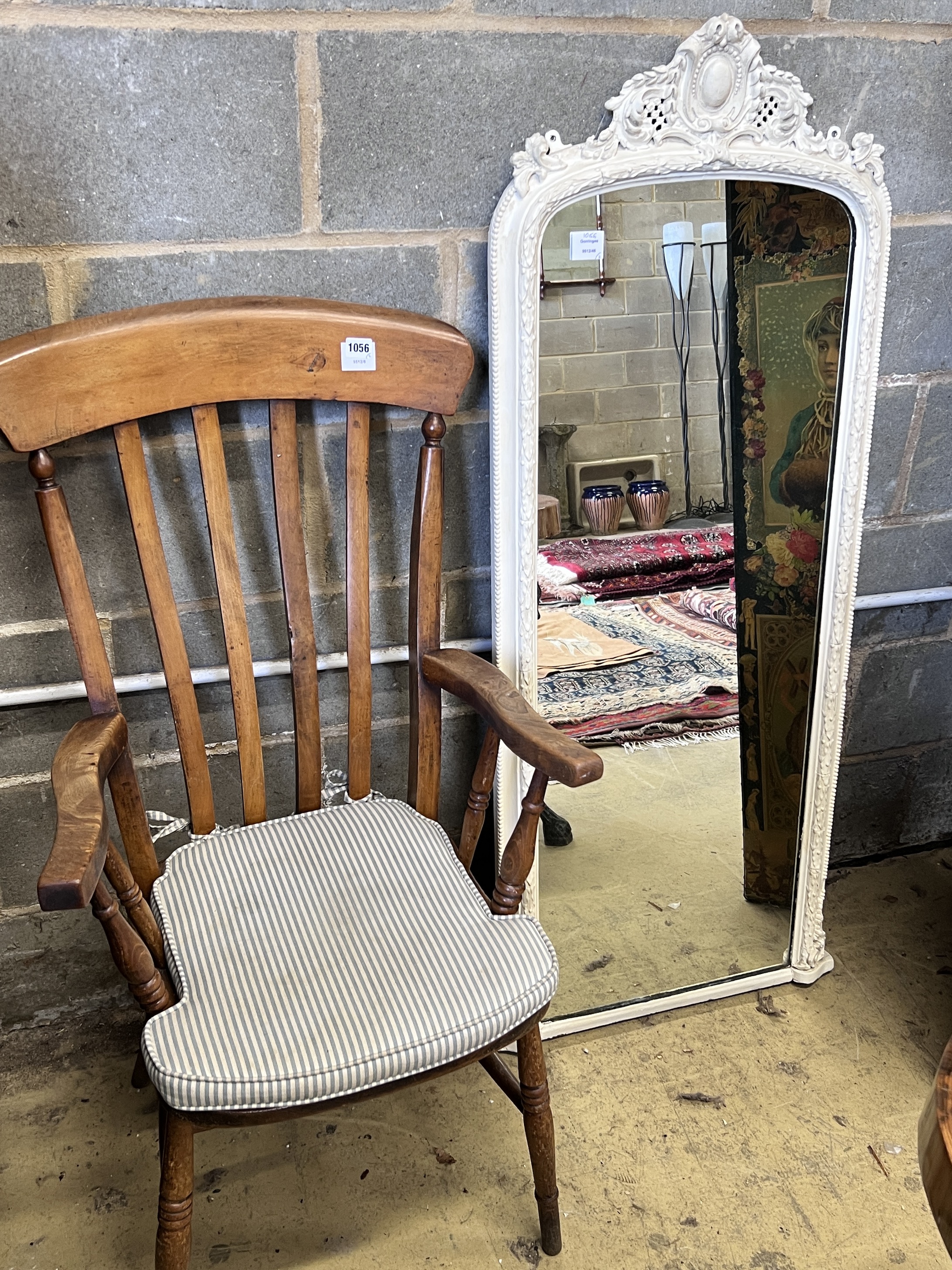 A late Victorian white painted pier glass, width 60cm, height 141cm and a Victorian lathe back Windsor armchair